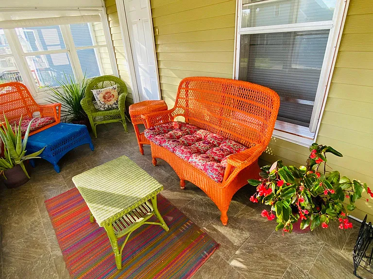 One of the Great room windows, front door, and light in the Sun porch.