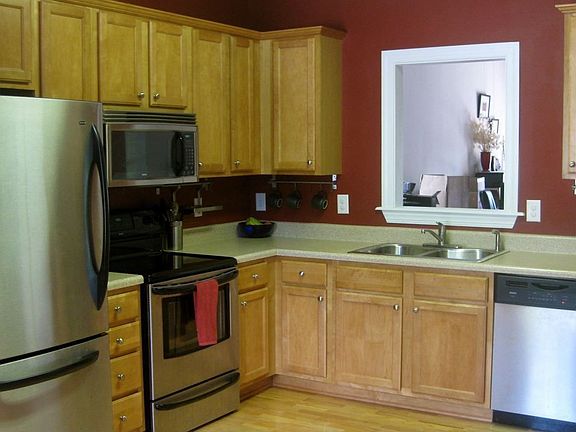 Eat in kitchen with all stainless steel appliances