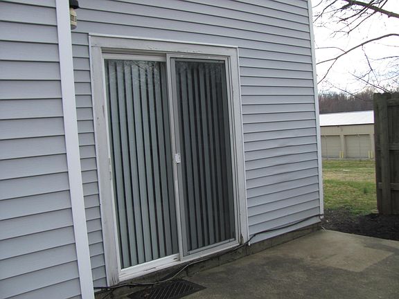 Sliding door entrance from patio area.