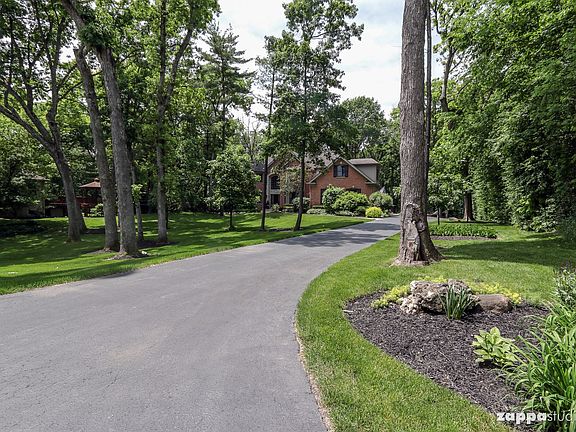 Set deep on a nearly 1 acre, stunning wooded lot.