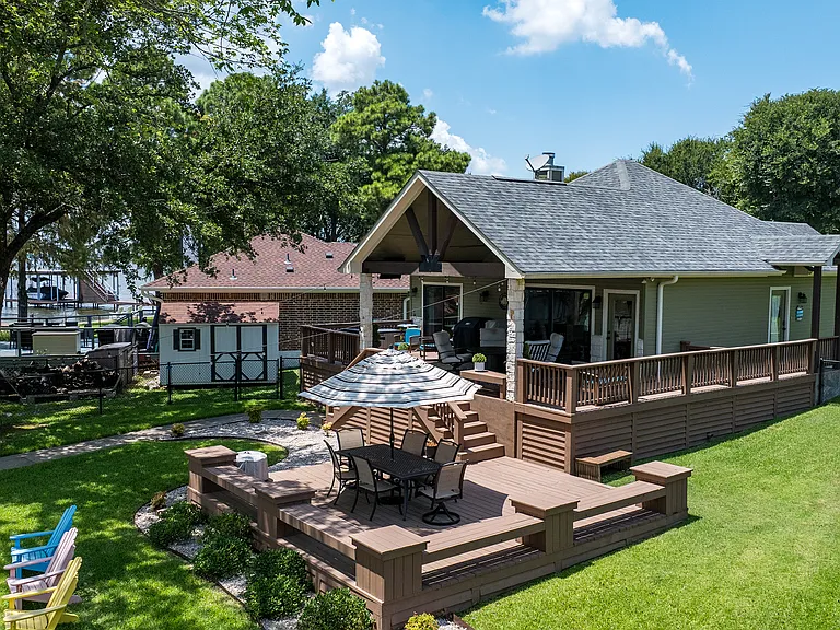Deck #1 - outdoor table with seating for 6 and an umbrella - plenty of other seating.