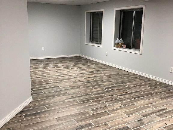Open concept 1 with beautiful tile floor. Very large