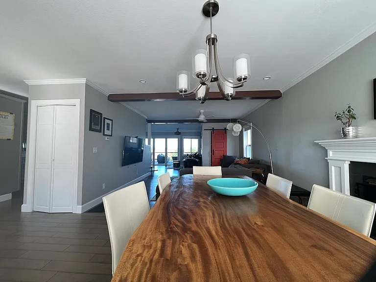 Dining table looking towards TV area and back of the house