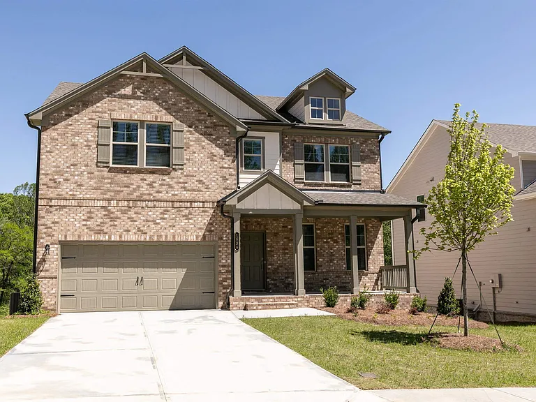 Exterior of the Wakehurst, two story home with a private driveway and attached garage.