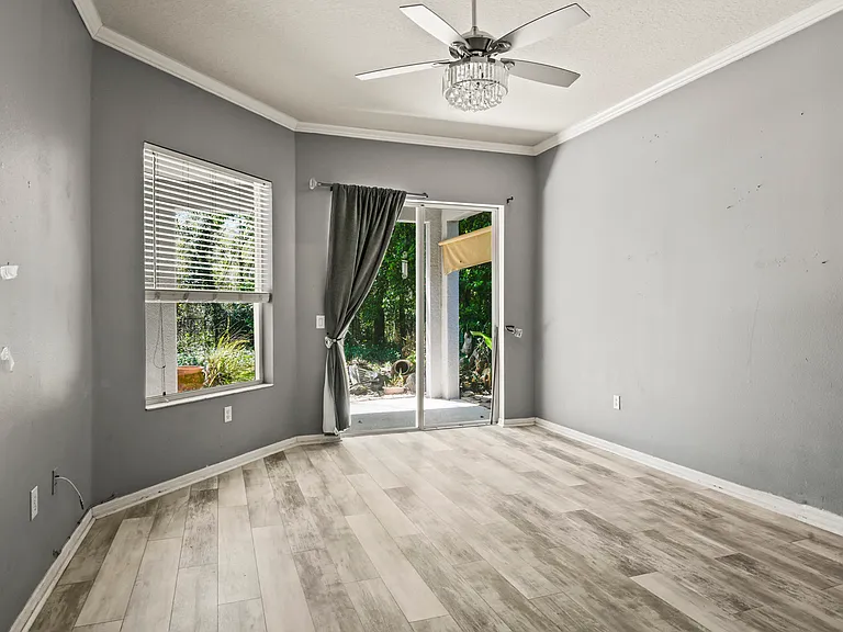 primary bedroom with view and access to lanai