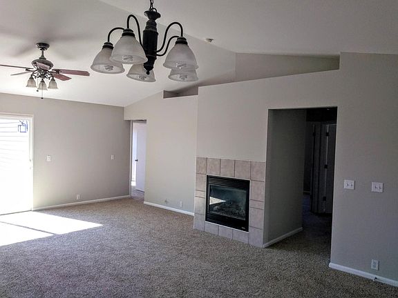 Gas fireplace, with master bedroom toward back left of photo.