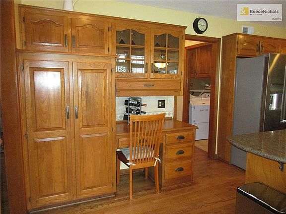 Kitchen Pantry & Glass-fronted Cabinets; View to Laundry Room