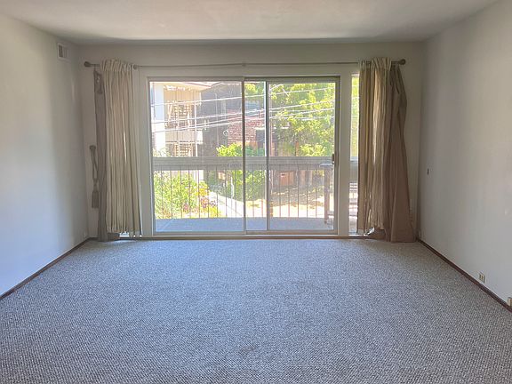 Living room view from kitchen (new paint and carpet)