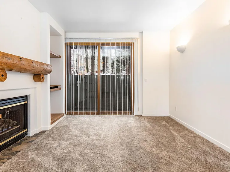 Living room with Gas Fireplace and patio