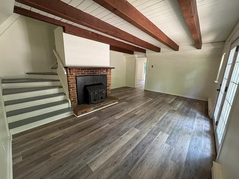 Front door to the right, enters into living room.