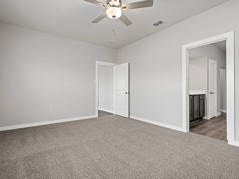 The master suite has a large bedroom, ensuite bathroom and a walk-in closet.