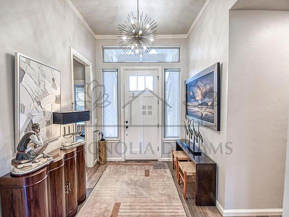 Entry. To left is a bedroom and a full bath