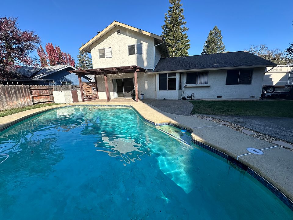 Inground gunite pool and rear of house