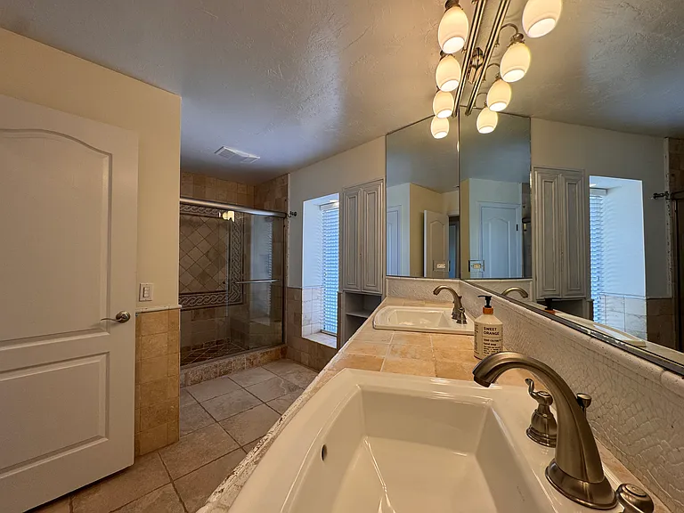 Bathroom #2 with dual sinks + shower