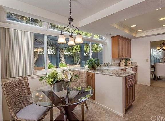 Upgraded Kitchen with Granite Countertops and Canister Lighting.