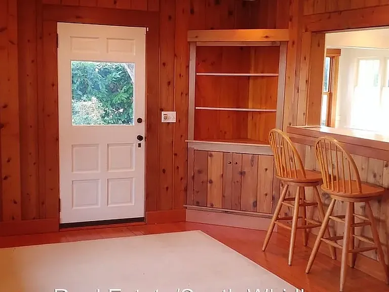 Front door entry into dining area and kitchen bar