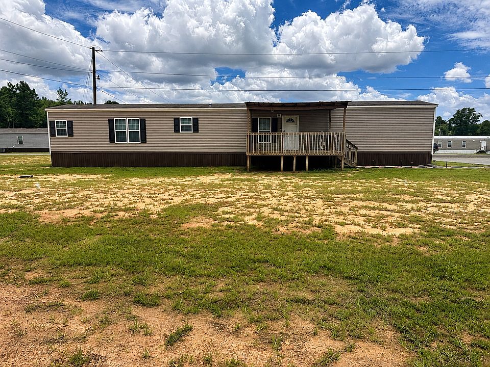 2018 singlewide mobile home with a large yard.