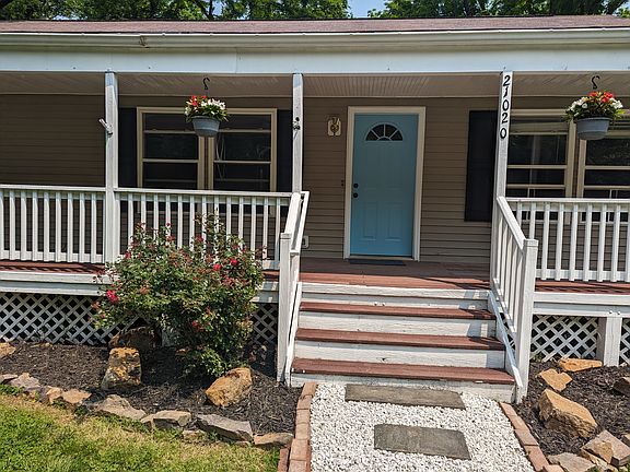 Front door and front porch of the cottage