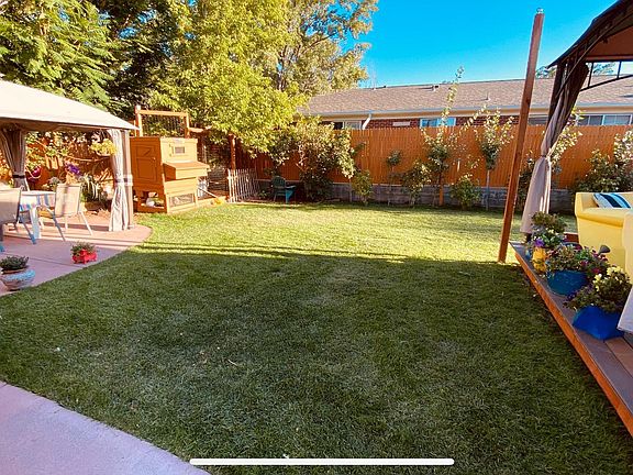 Private yard made for entertaining and large chicken mansion with enclosed run