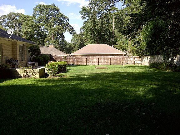 Large Backyard with raised beds and room to play
