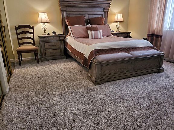 This is the main floor master suite. There is a whole wall of closets to the left and a full bath adjacent.