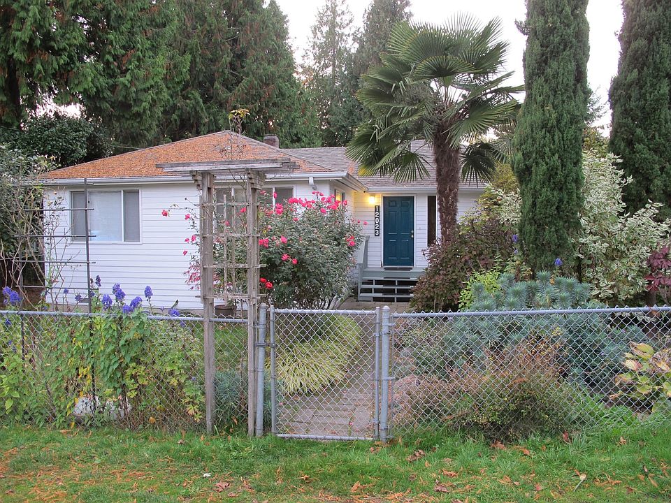 front view, mature gardens