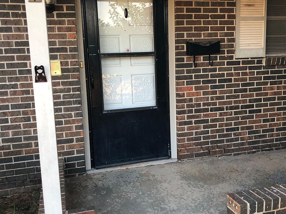 Covered front porch with ample room for seating and plants.