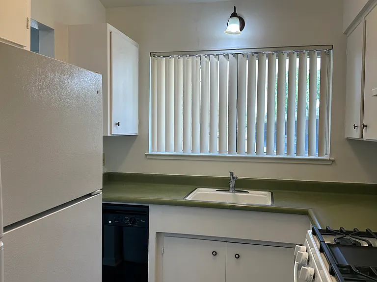 Step saver kitchen with gas range and plenty of cabinets