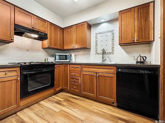 view of kitchen (note: Dishwasher has been updated since this photo)