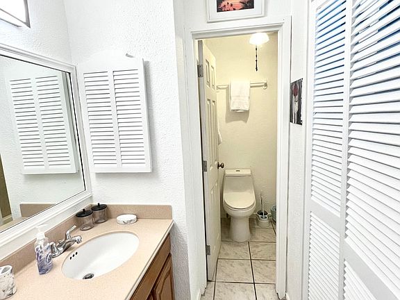 Bathroom 1 with a bathtub/shower and walk-in closet