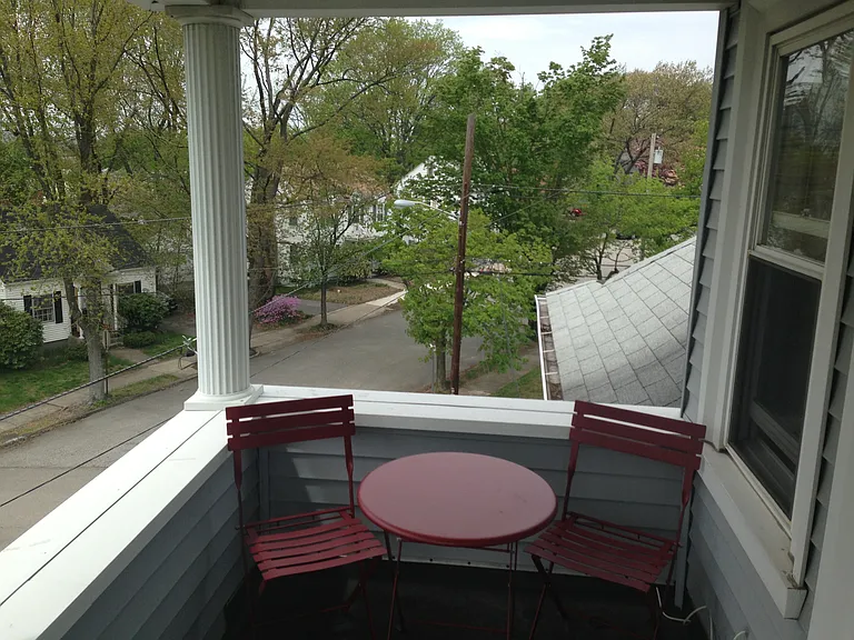 balcony overlooking the neighborhood.