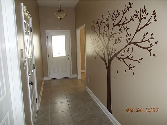 FRONT ENTRANCE FROM THE FRONT DOOR - DINING ROOM TO THE LEFT OF THE ENTRY WAY