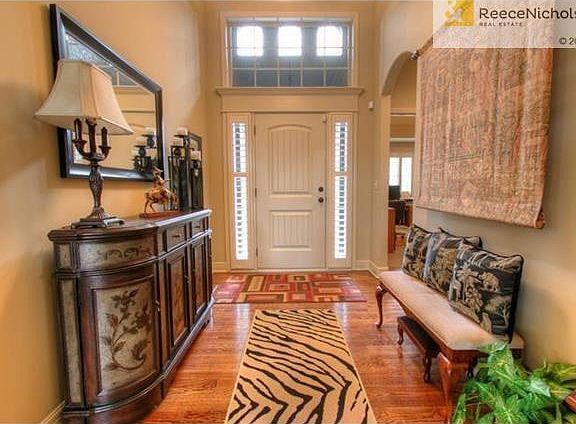 Spacious entry with beautiful wood floors
