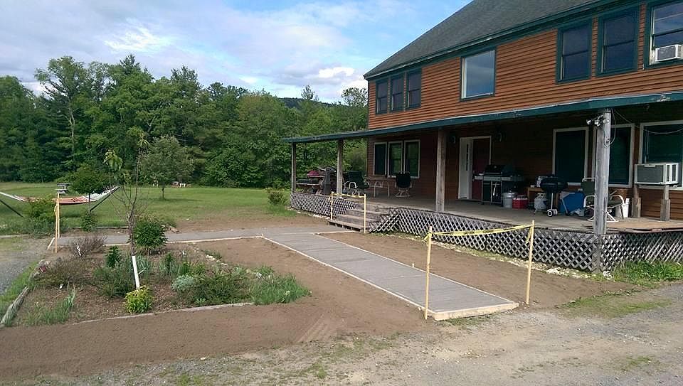 Front of house with sidewalk project.