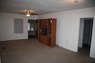 Living Room. Large open living/dining room looking out onto sun porch