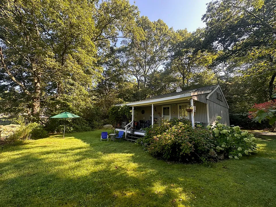View of the back of the cottage and yard