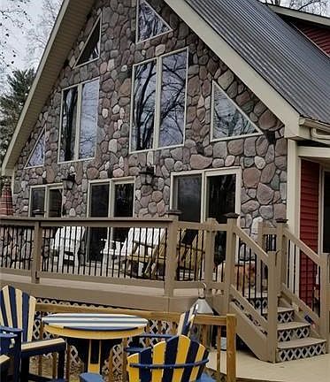 House facing the river....gorgeous stone and metal roof