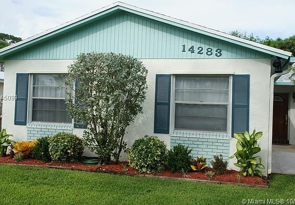 Beautifully Landscaped Front of the Large 2 Car Garage Including 2 Large Windows that let in the light