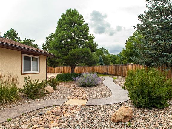 Beautifully landscaped with a path to the play area