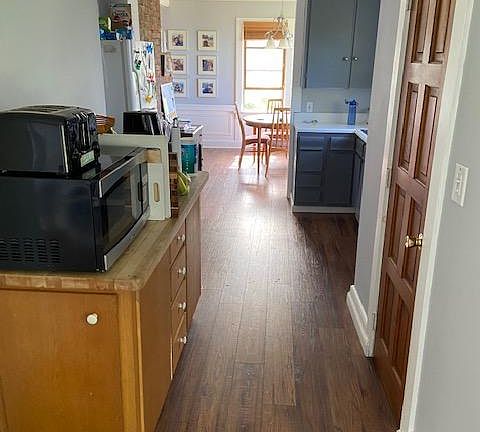 Across kitchen into dining room