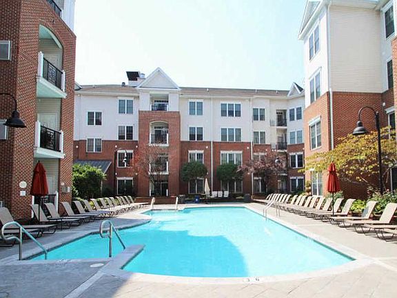 Gated swimming pool w/ lifeguard