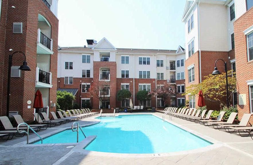 Gated swimming pool w/ lifeguard