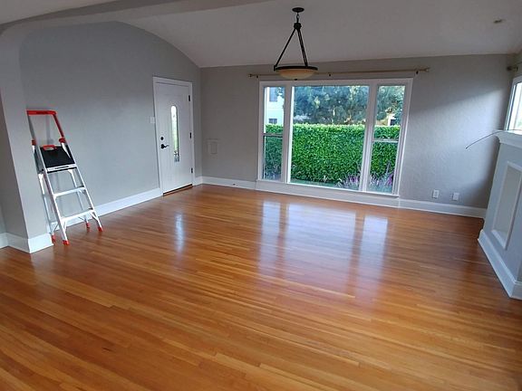 dining/living room view out to your ficus-hedged yard.