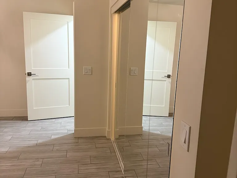 This is one of two large Primary Suite closets. This has 8' wide sliding mirrors, perfect to locate dressers out of the way