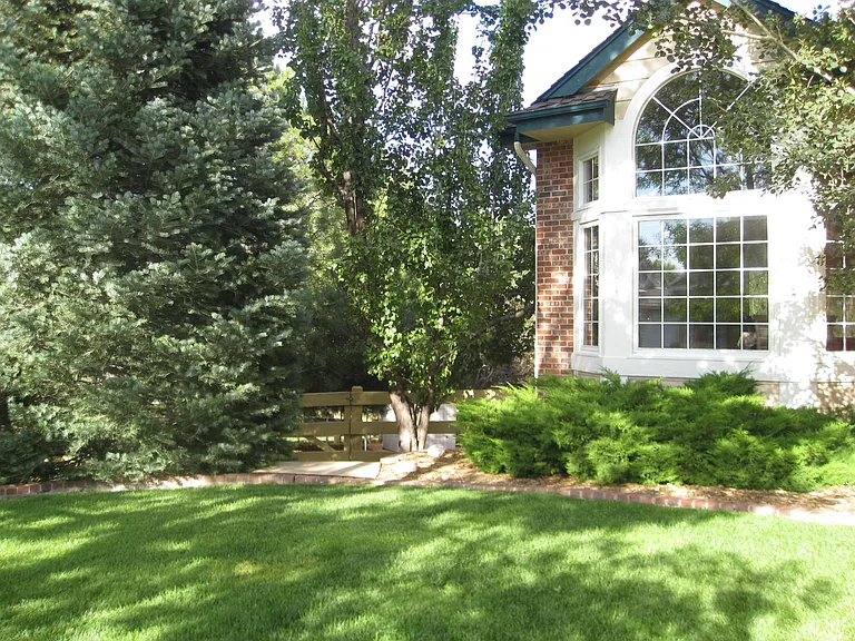 Gate to backyard and entrance to downstairs apartment