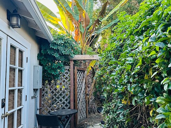 Private outdoor patio with seating, accessible directly from the studio