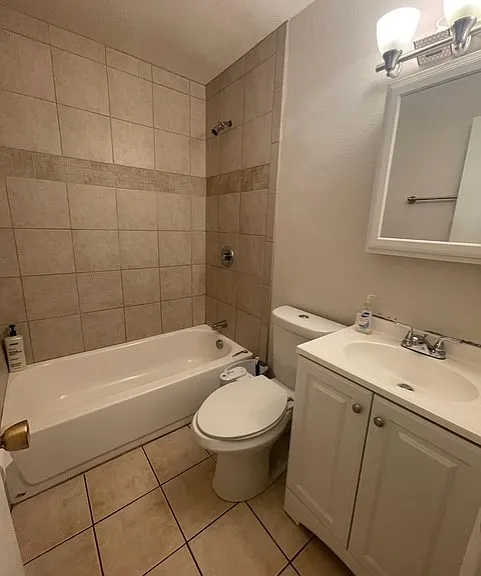 Hallway bathroom with shower and tub