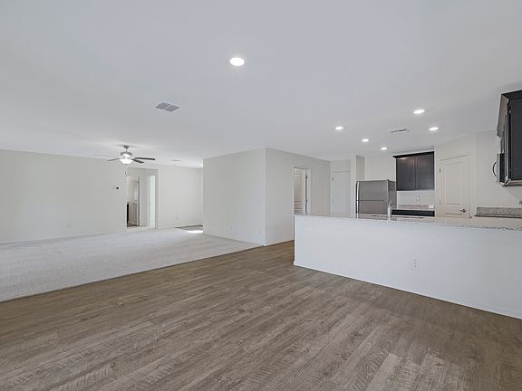Open-concept layout with the kitchen overlooking the dining area.