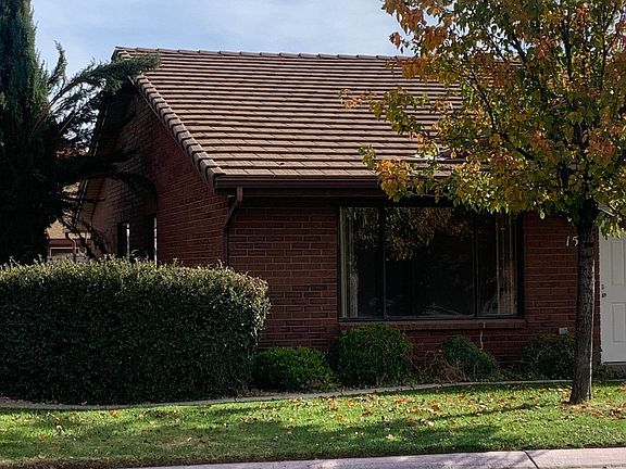 Mature landscaping with access to gated backyard.