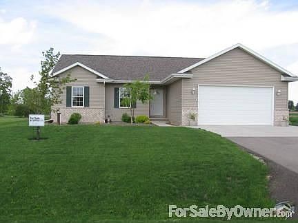 Quality, three year old home-landscaped
						:
						View of the home from the quiet, subdivision road. Landscaping & lawn completed.